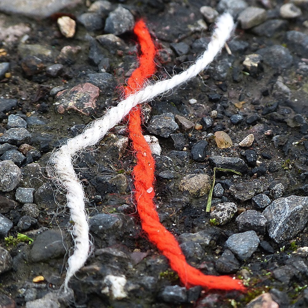 Red and white string on the road