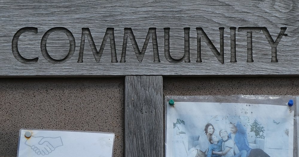 A public community noticeboard's sign